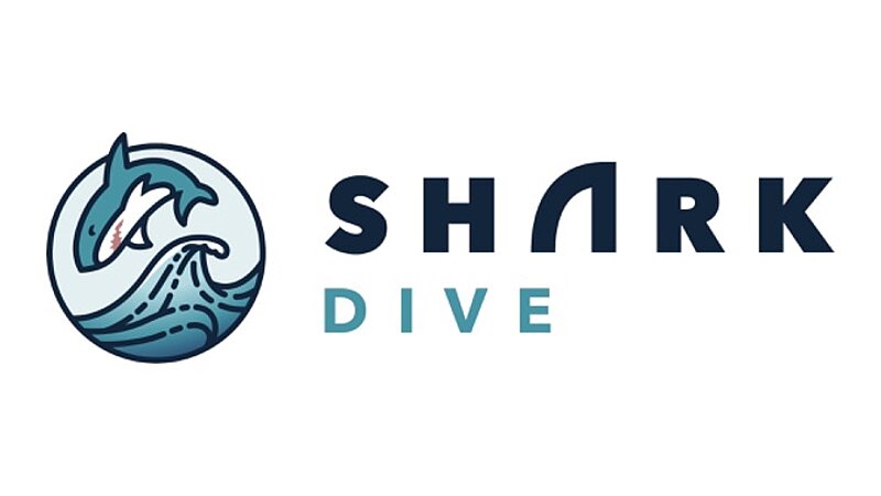 A logo depicting a shark jumping over a wave is shown, along with the words "Shark dive" to the right hand-side. The 'A' in shark has a shark fin design. 